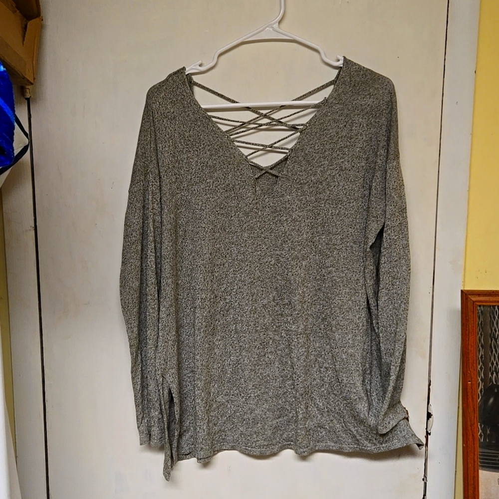 Long sleeve grey shirt with lace strings showing off cleavage. Size larger